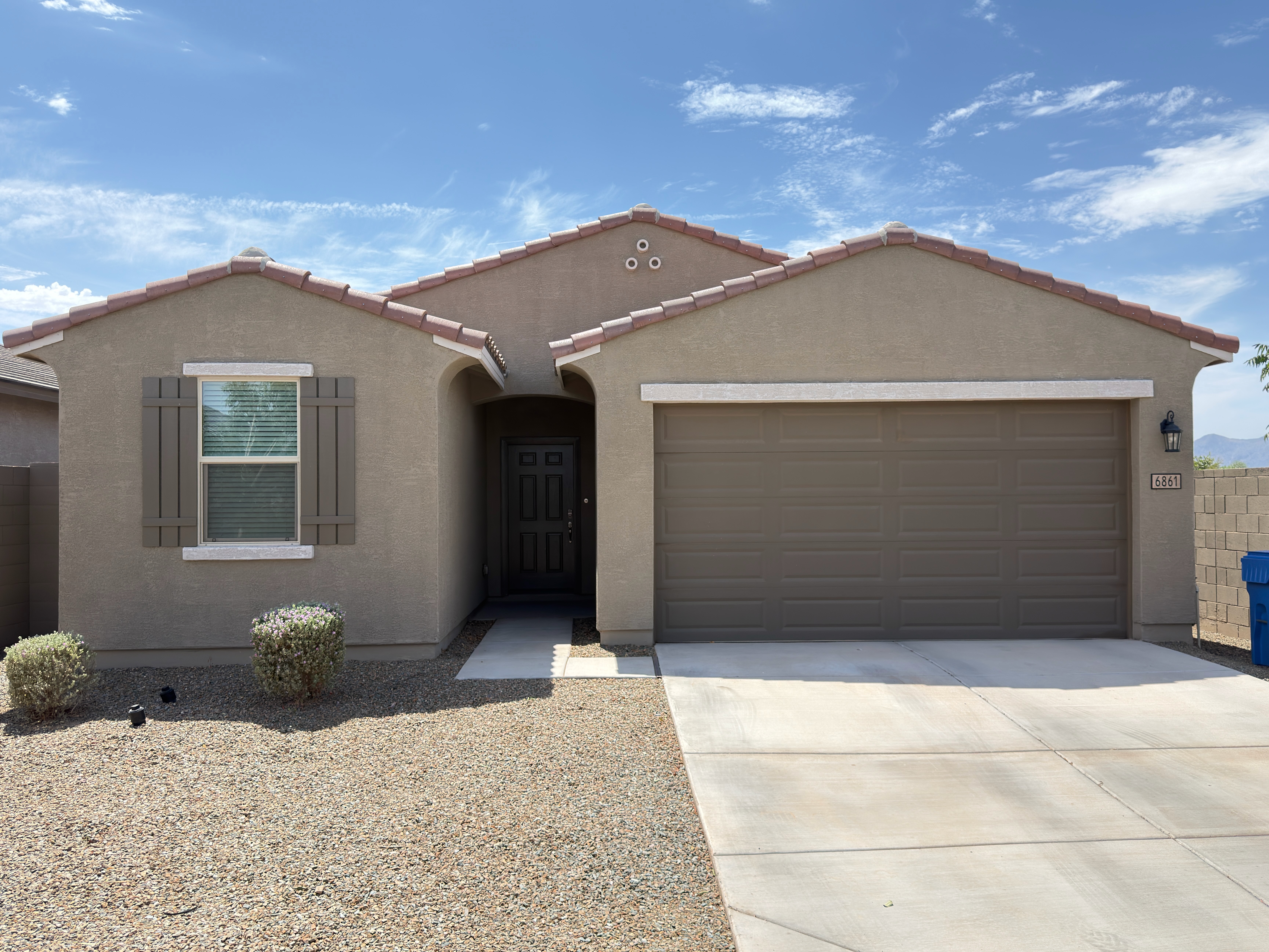 Residential house exterior after gray paint with white trim